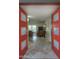 Bright entryway with red double doors opening to living room at 6151 E Harvard St, Scottsdale, AZ 85257