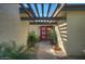 Inviting entryway with red doors and a pathway lined with plants at 6151 E Harvard St, Scottsdale, AZ 85257