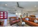 Spacious living room with leather sofas and a view into kitchen at 6151 E Harvard St, Scottsdale, AZ 85257