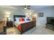 Spacious main bedroom with a king-size bed and ensuite bathroom at 6151 E Harvard St, Scottsdale, AZ 85257