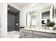 Bathroom with gray tile, granite countertops, and double vanity at 6733 W Desert Dr, Laveen, AZ 85339