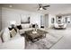 Spacious living room with white shiplap accent wall and neutral furnishings at 6733 W Desert Dr, Laveen, AZ 85339