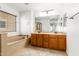 Double vanity bathroom with soaking tub and updated fixtures at 6845 S 7Th Ln, Phoenix, AZ 85041