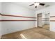 Bedroom with mirrored closet doors and ceiling fan at 6845 S 7Th Ln, Phoenix, AZ 85041