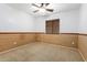 Bedroom with wood-look wall accents and ceiling fan at 6845 S 7Th Ln, Phoenix, AZ 85041