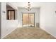 Dining room with tile flooring and sliding glass doors to backyard at 6845 S 7Th Ln, Phoenix, AZ 85041