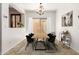 Dining room with a wood table, black chairs, and access to a patio at 6845 S 7Th Ln, Phoenix, AZ 85041