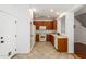 Clean kitchen featuring wood cabinets, tile floor, and modern appliances at 6845 S 7Th Ln, Phoenix, AZ 85041