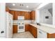 Bright kitchen with ample wood cabinets and modern appliances at 6845 S 7Th Ln, Phoenix, AZ 85041