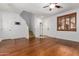 Living room with hardwood floors, stairs, and a view of the front door at 6845 S 7Th Ln, Phoenix, AZ 85041