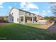 Two-story home with grassy backyard, covered patio and pool at 687 E Cleveland Ct, San Tan Valley, AZ 85140