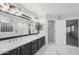 Elegant bathroom with double vanity, marble countertops, and large mirror at 687 E Cleveland Ct, San Tan Valley, AZ 85140