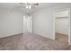 Comfortable bedroom with ceiling fan and closet at 687 E Cleveland Ct, San Tan Valley, AZ 85140