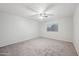 Bright bedroom with ceiling fan and neutral carpeting at 687 E Cleveland Ct, San Tan Valley, AZ 85140