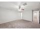 Bright and airy bedroom with neutral walls and ceiling fan at 687 E Cleveland Ct, San Tan Valley, AZ 85140