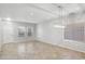 Spacious dining room with large windows and modern chandelier at 687 E Cleveland Ct, San Tan Valley, AZ 85140