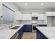 Modern kitchen with blue cabinets, white countertops, and a large kitchen island at 687 E Cleveland Ct, San Tan Valley, AZ 85140