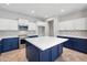 Spacious kitchen with large island, blue cabinets, and white countertops at 687 E Cleveland Ct, San Tan Valley, AZ 85140