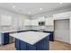 Modern kitchen with blue cabinetry, white countertops, and stainless steel appliances at 687 E Cleveland Ct, San Tan Valley, AZ 85140