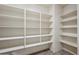 Large walk-in pantry with ample shelving for storage at 687 E Cleveland Ct, San Tan Valley, AZ 85140