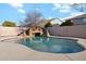 Relaxing kidney shaped pool with a waterfall feature at 687 E Cleveland Ct, San Tan Valley, AZ 85140