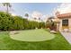 Putting green and mature landscaping enhance this backyard oasis at 7860 W Taro Ln, Glendale, AZ 85308