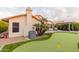 Putting green and spacious patio create an entertainer's paradise at 7860 W Taro Ln, Glendale, AZ 85308