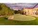 Putting green and a relaxing backyard view at 7860 W Taro Ln, Glendale, AZ 85308