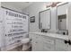 Bathroom with white vanity, frameless mirror and shower at 7860 W Taro Ln, Glendale, AZ 85308