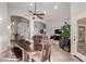 Bright dining room featuring a large wooden table with seating at 7860 W Taro Ln, Glendale, AZ 85308