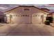 Two-car garage with desert landscaping at 7860 W Taro Ln, Glendale, AZ 85308