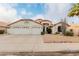 Two-story house with a three-car garage and desert landscaping at 7860 W Taro Ln, Glendale, AZ 85308