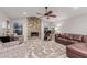 Cozy Gathering room with a stone fireplace and leather sofas at 7860 W Taro Ln, Glendale, AZ 85308