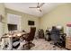 Home office featuring two workstations and ceiling fan at 7860 W Taro Ln, Glendale, AZ 85308