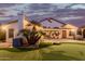 Well-maintained home exterior with putting green at 7860 W Taro Ln, Glendale, AZ 85308