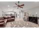 Open living room with modern kitchen and a comfy sectional sofa at 7860 W Taro Ln, Glendale, AZ 85308