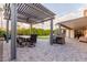 Pergola with dining table and seating area at 7860 W Taro Ln, Glendale, AZ 85308