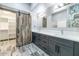 Bathroom with double vanity and barn door to closet at 8712 W Sequoia Dr, Peoria, AZ 85382