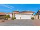 Single story home with solar panels and a two car garage at 8712 W Sequoia Dr, Peoria, AZ 85382