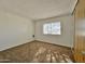 Simple bedroom with carpet and window at 8738 W Tinajas Dr, Arizona City, AZ 85123