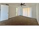 Bedroom with ceiling fan, sliding door closet, and carpet at 8738 W Tinajas Dr, Arizona City, AZ 85123