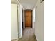 Hallway with carpet and built-in storage at 8738 W Tinajas Dr, Arizona City, AZ 85123