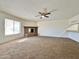 Living room with a fireplace and view into the kitchen area at 8738 W Tinajas Dr, Arizona City, AZ 85123