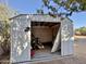 Exterior shed with open door at 8738 W Tinajas Dr, Arizona City, AZ 85123