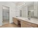 Double sink vanity with a large mirror and walk in shower at 8965 E Maple Dr, Scottsdale, AZ 85255