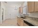 Kitchen with granite counters, light wood cabinets, and stainless steel appliances at 8965 E Maple Dr, Scottsdale, AZ 85255