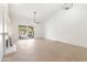 Living room with fireplace, tile floors, and sliding glass doors at 8965 E Maple Dr, Scottsdale, AZ 85255