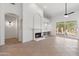 Bright living room with fireplace and tile flooring at 8965 E Maple Dr, Scottsdale, AZ 85255