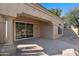 Covered patio with sliding glass doors leading to the backyard at 8965 E Maple Dr, Scottsdale, AZ 85255