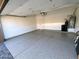 Clean and spacious garage featuring epoxy floors and ample storage space at 9672 E Davenport Dr, Scottsdale, AZ 85260